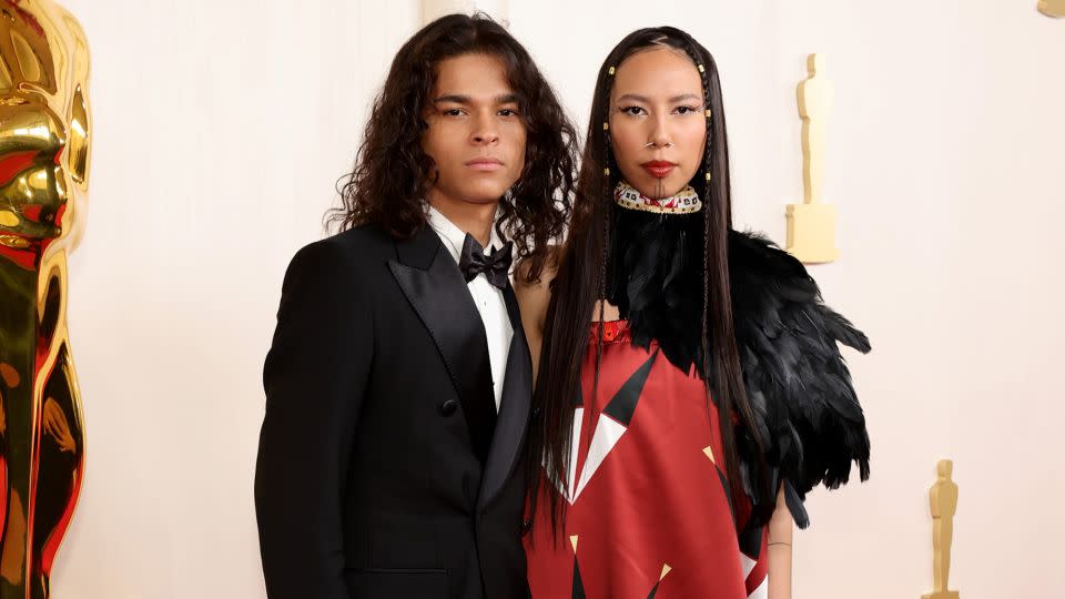 "Reservation Dogs" actor D'Pharaoh Woon-A-Tai wore a double-breasted Dolce & Gabbana suit, while model and activist Quannah Chasinghorse opted for a look by Native American fashion line Red Berry Woman. - Arturo Holmes/Getty Images