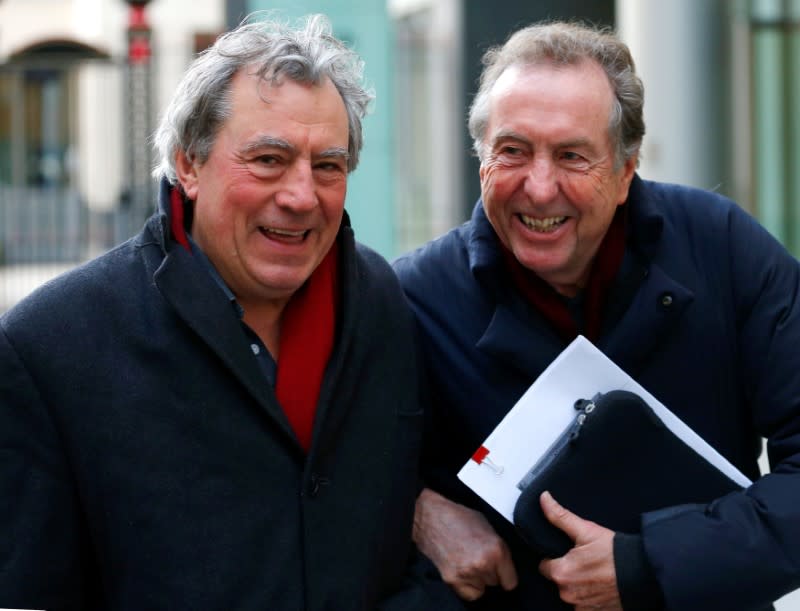 FILE PHOTO: Monty Python members Eric Idle and Terry Jones leave the High Court during a lunch break in central London