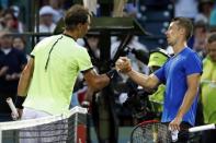 Mar 26, 2017; Miami, FL, USA; Rafael Nadal of Spain (L) shakes hands with Philip Kohlschreiber of Germany (R) after their match on day six of the 2017 Miami Open at Crandon Park Tennis Center. Nadal won 0-6, 6-2, 6-3. Mandatory Credit: Geoff Burke-USA TODAY Sports