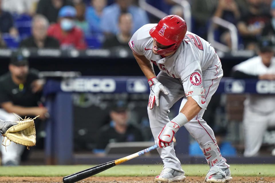 Los Angeles Angels' Mike Trout reacts after being hit by a pitch thrown by Miami Marlins' Trevor Rogers during the fifth inning of a baseball game, Wednesday, July 6, 2022, in Miami. (AP Photo/Lynne Sladky)