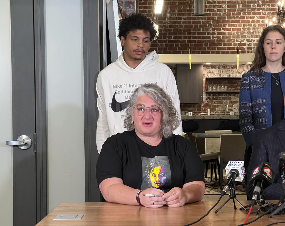 Rebecca Duran, bottom, mother of Donovan Lewis and Tariq Stewart, top, brother of Donovan Lewis address the media on Friday, Aug. 4, 2023, in Columbus, Ohio, after a grand jury indicted former officer Ricky Anderson in the fatal shooting of 20-year-old Donovan Lewis. (AP Photo/Patrick Orsagos)