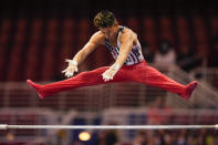 Yul Moldauer competes on the horizontal bar during the men's U.S. Olympic Gymnastics Trials Thursday, June 24, 2021, in St. Louis. (AP Photo/Jeff Roberson)