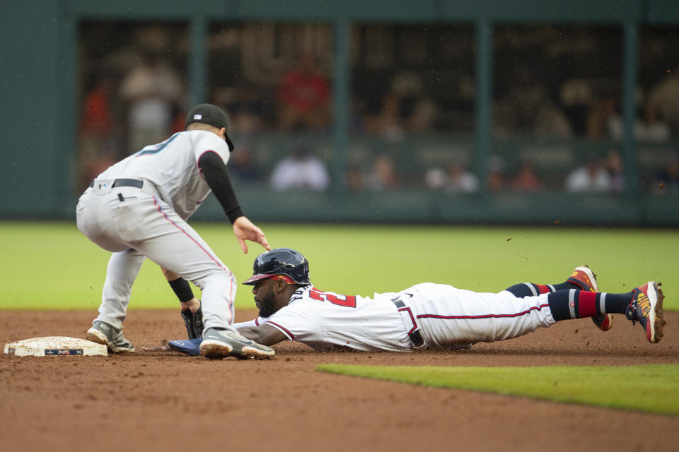 Miami Marlins second base Charles Leblanc, left, tags out Atlanta Braves Michael Harris II, right, who was was caught stealing second base in the sixth inning of a baseball game Sunday, Sept. 4, 2022, in Atlanta. (AP Photo/Hakim Wright Sr.)