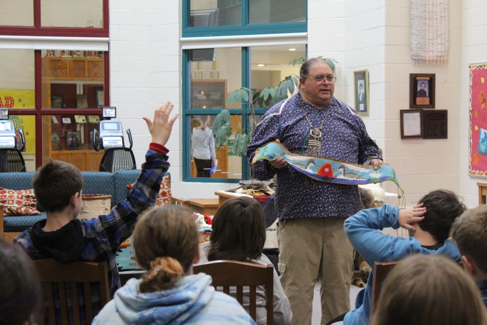 On Monday, Oct. 30 at Overlook Middle School, Princeton deputy fire chief Tim Kelly explains the significance of regalia worn and made by Native Americans during the annual Native American Day event.