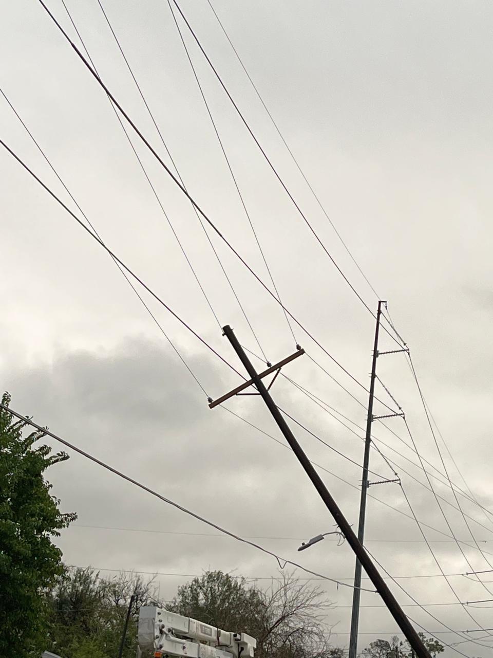 Strong winds from a storm knocked down a power pole near Cleveland Street in Houma on Wednesday, Dec. 14, 2022.