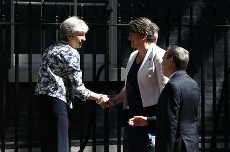 Britain's Prime Minister, Theresa May, shakes hands with Democratic Unionist Party (DUP) Leader Arlene Foster, outside 10 Downing Street, in central London, Britain June 26, 2017. REUTERS/Neil Hall