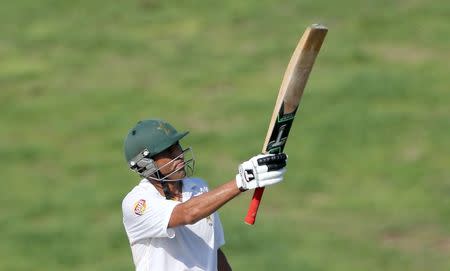 Cricket - Pakistan v England - First Test - Zayed Cricket Stadium, Abu Dhabi, United Arab Emirates - 13/10/15 Pakistan's Younis Khan raises his bat after becoming Pakistan's leading test run scorer Action Images via Reuters / Jason O'Brien Livepic