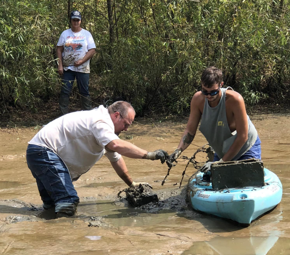 Butler County Coroner Jim Akers and Gage Goodwin retrieving Edward Goodwin’s remains (Connie Goodwin/Facebook)