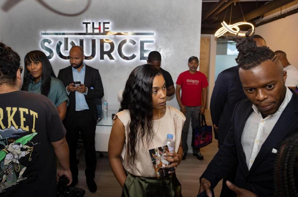 Desiray Malcolm, center, an account manager at Kaseya whose mentors are Ted Lucas and Hilmon Sorey, co-founders of The Source, networks with other attendees during the opening of The Source, a Black-owned tech hub for networking, accelerators and co-working, on Thursday, Feb. 15, 2024, in downtown Miami.