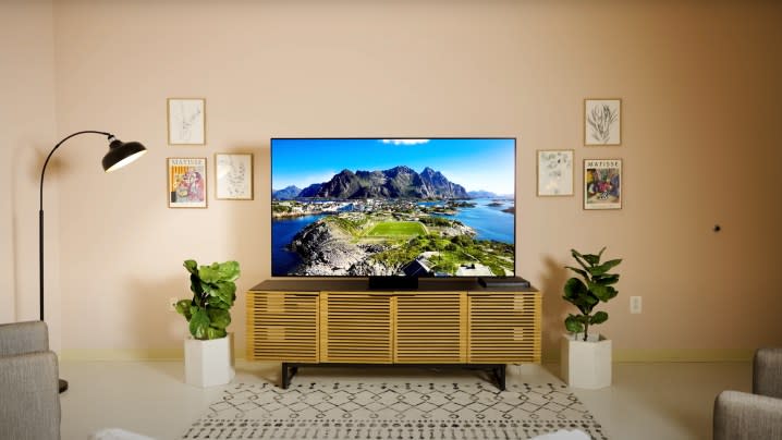 A Samsung S95D OLED TV in a living room displaying an ocean vista. 