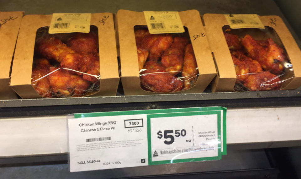 A Reddit user spotted what appears to be a crude word scribbled on boxes of Woolworths chicken wings. Source: Reddit/ AwwwwwwwwwWYeah
