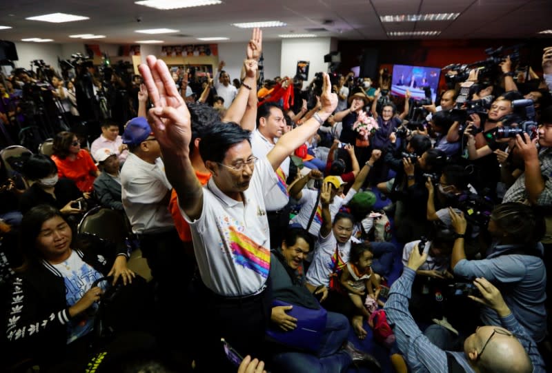 Supporters of Future Forward Party react after Thailand's Constitutional Court ruled that key figures of the opposition Future Forward Party were not guilty of opposing the monarchy, at the party's headquarters in Bangkok
