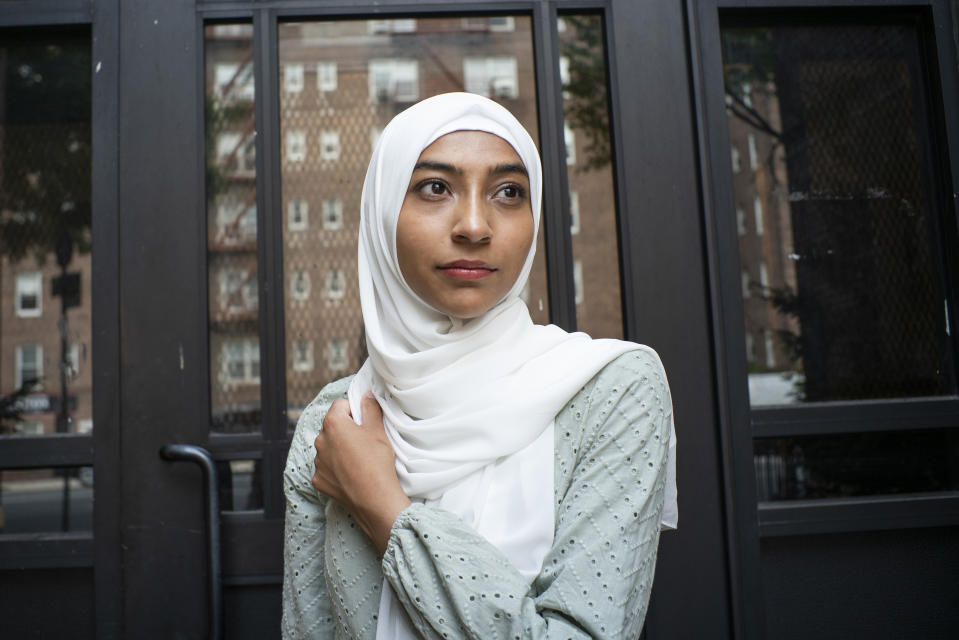 Ameena Ahmed poses for a photo near her home on Tuesday, July 27, 2021, in the Brooklyn borough of New York. After her work as a substitute teacher in New York City dried up, Ameena Ahmed got a welcome $4,200 boost last summer in federal pandemic-related unemployment benefits.Then New York state started taking it back. (AP Photo/Eduardo Munoz Alvarez)