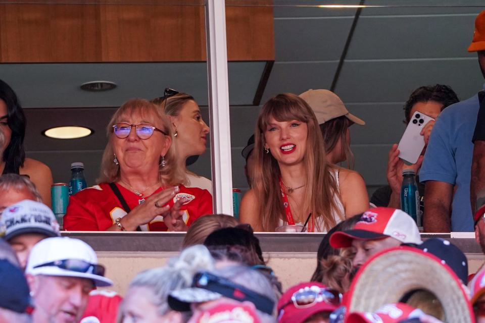 Taylor Swift reacts while sitting next to Donna Kelce, Travis Kelce's mom, at the Kansas City Chiefs vs. Chicago Bears game.