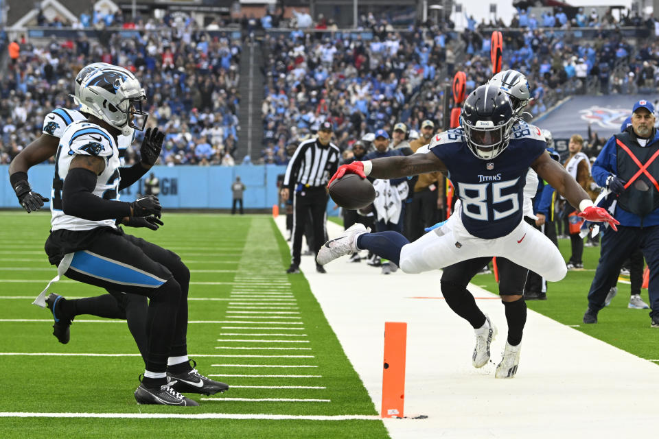Tennessee Titans tight end Chigoziem Okonkwo (85) dives for the goal line during the first half of an NFL football game against the Carolina Panthers Sunday, Nov. 26, 2023, in Nashville, Tenn. Okonkwo was stopped just short of the goal line. (AP Photo/John Amis)