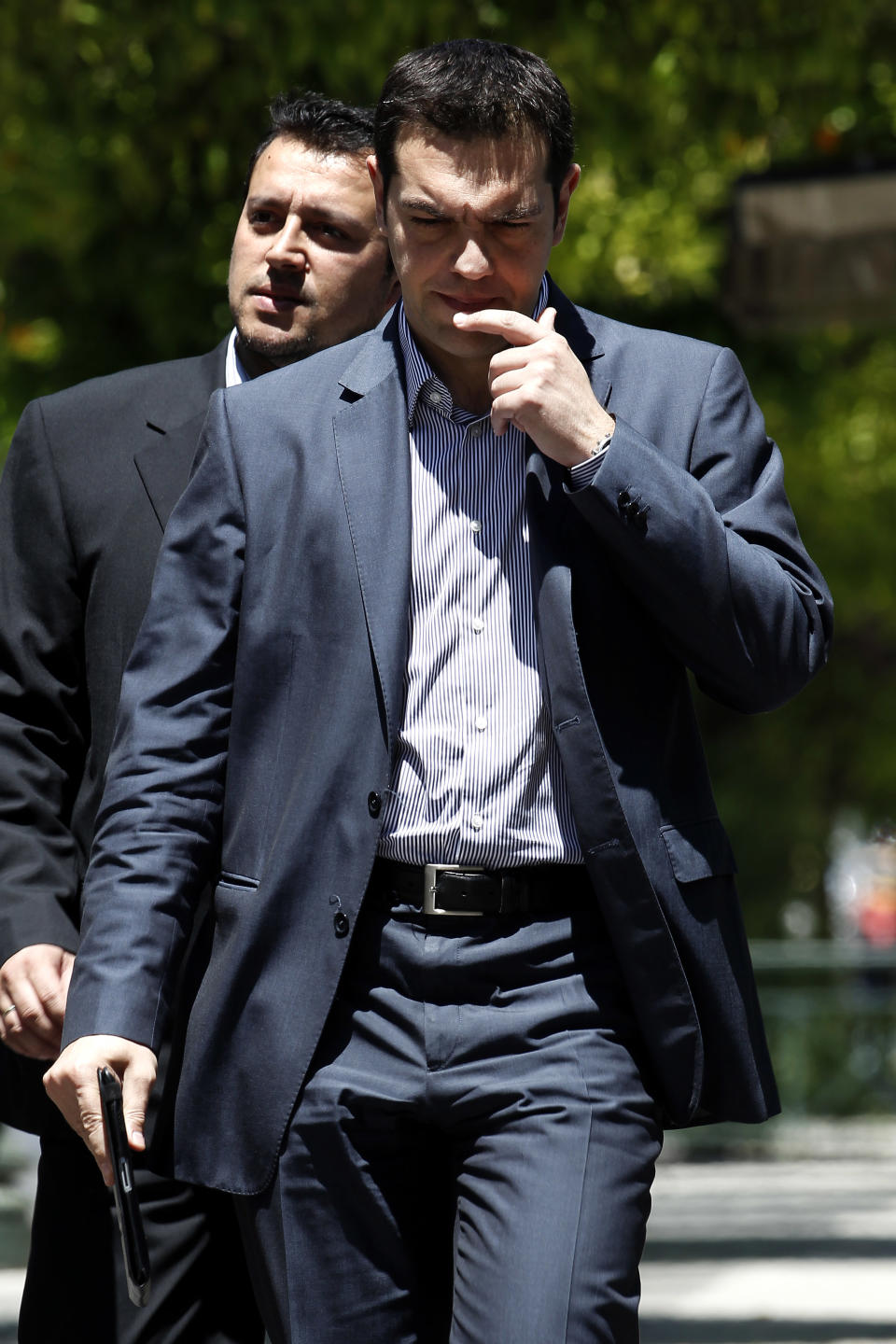 Greek leader of Coalition of the Radical Left Party SYRIZA Alexis Tsipras arrives at the presidential palace for a meeting with President Karolos Papoulias, in Athens, on Tuesday, May 15, 2012. Greece's president is to meet the leaders of five political parties, broadening talks to try and form a coalition government and end a nine-day deadlock in the crisis-hit country. (AP Photo/Petros Giannakouris)