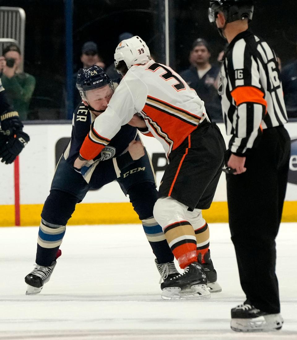 Jan. 19, 2023; Columbus, Ohio, USA; Columbus Blue Jackets right wing Mathieu Olivier (24) and Anaheim Ducks center Sam Carrick (39) fight during the first period of Thursday's game at Nationwide Arena. Mandatory Credit: Barbara J. Perenic/Columbus Dispatch