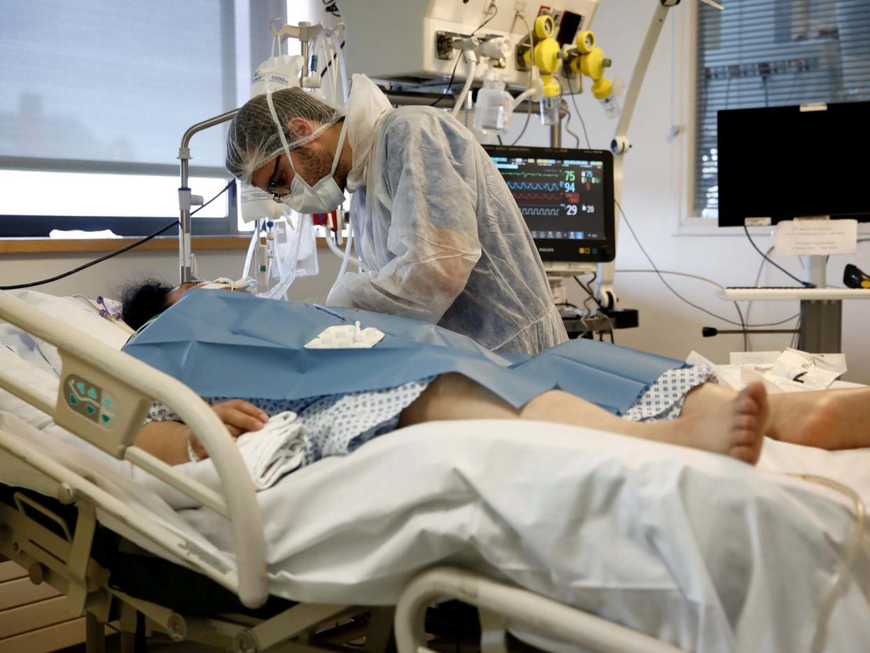 A Covid-19 patient is treated at the intensive care unit at the Institut Mutualiste Montsouris (IMM) hospital in Paris: Benoit Tessier/Reuters