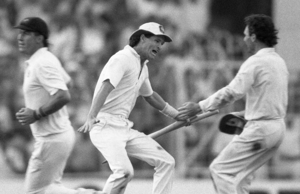 Jones celebrates with the Australian captain Allan Border at the end of the 1987 World Cup final, a seven-run victory against England - Liu Heung Shing/AP