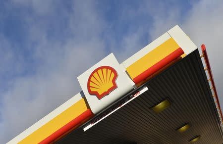 Shell branding is seen at a petrol station in west London, January 29, 2015. REUTERS/Toby Melville