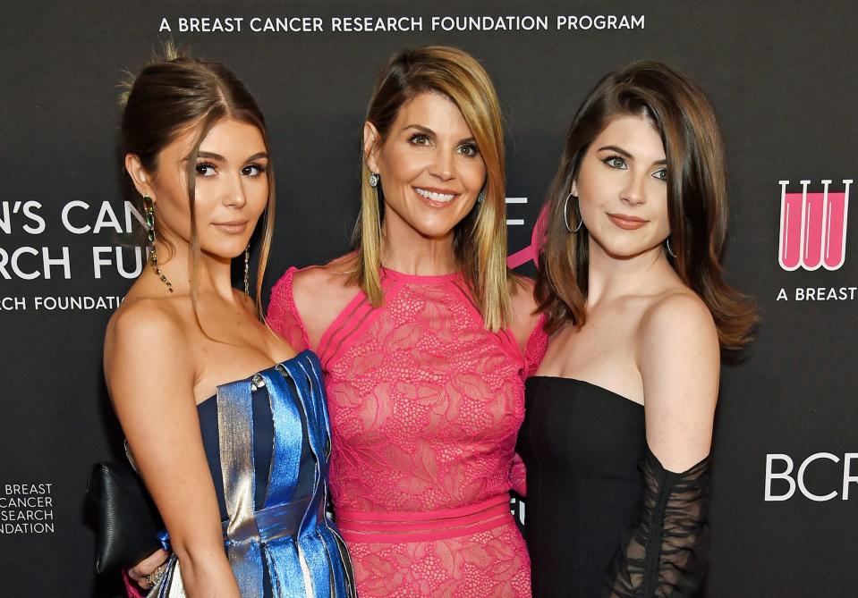 Lori Loughlin (center) with her daughters Olivia Jade (left) and Isabella (right).