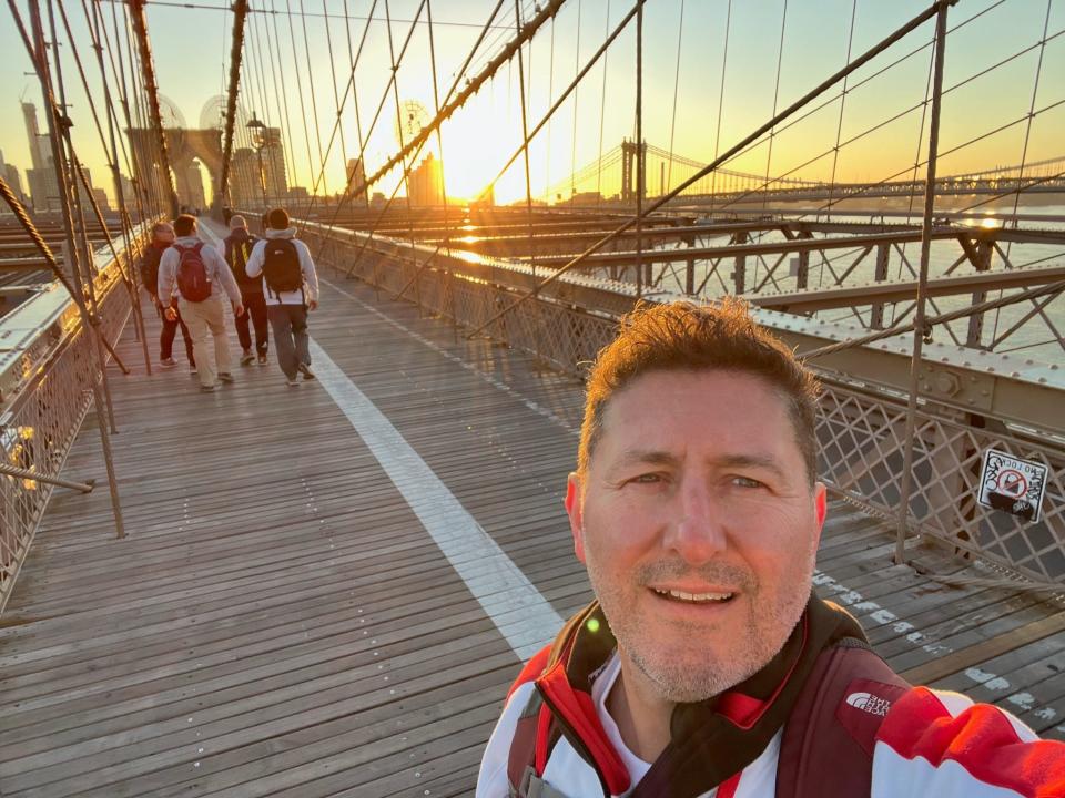 Bill McHugh crosses the Brooklyn Bridge for a fundraiser for multiple myeloma, a type of blood cancer he's survived for more than 15 years.
