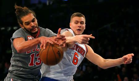 Dec 19, 2015; New York, NY, USA; Chicago Bulls center Joakim Noah (13) and New York Knicks forward Kristaps Porzingis (6) battle for a rebound during the first half at Madison Square Garden. Mandatory Credit: Noah K. Murray-USA TODAY Sports