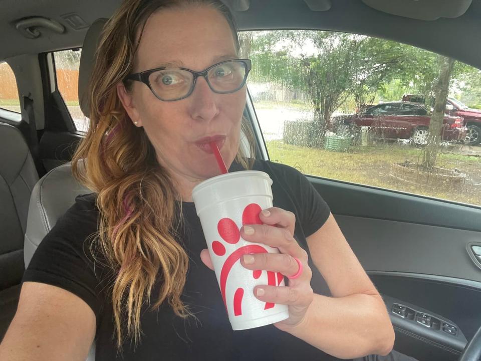 Selfie of the writer with a cup of Chick-fil-A sweet tea