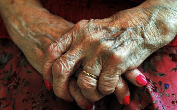 Old lady, crossed hands - Credit: John Stillwell/PA