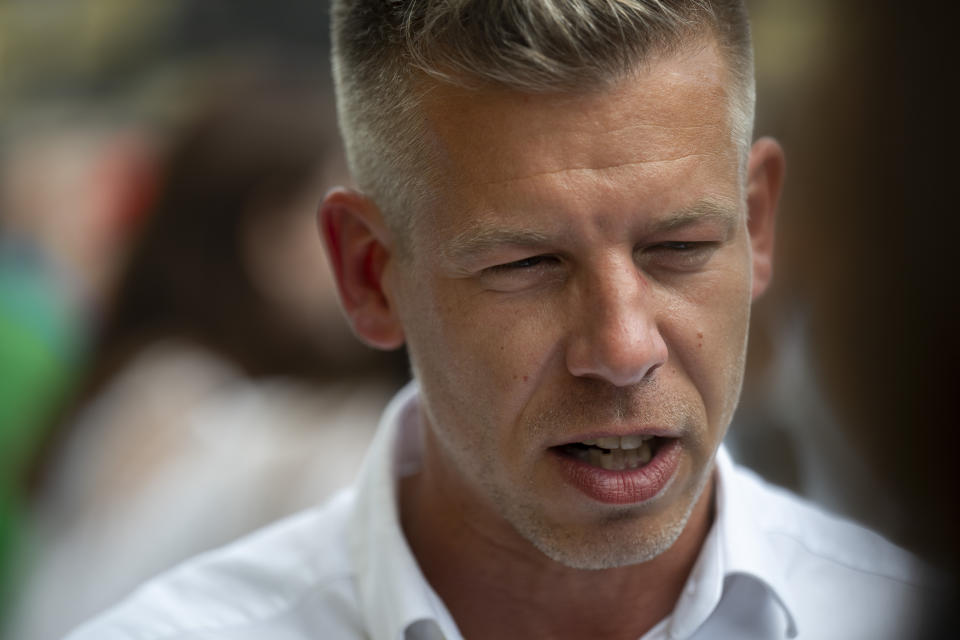 Péter Magyar, a rising challenger to Hungarian Prime Minister Viktor Orbán, speaks before addressing people at a campaign rally in the rural city of Debrecen, Hungary, on Sunday, May 5, 2024. Magyar, whose TISZA party is running in European Union elections, has managed to mobilize large crowds of supporters on a campaign tour of Hungary's heartland, a rarity for an Orbán opponent. (AP Photo/Denes Erdos)