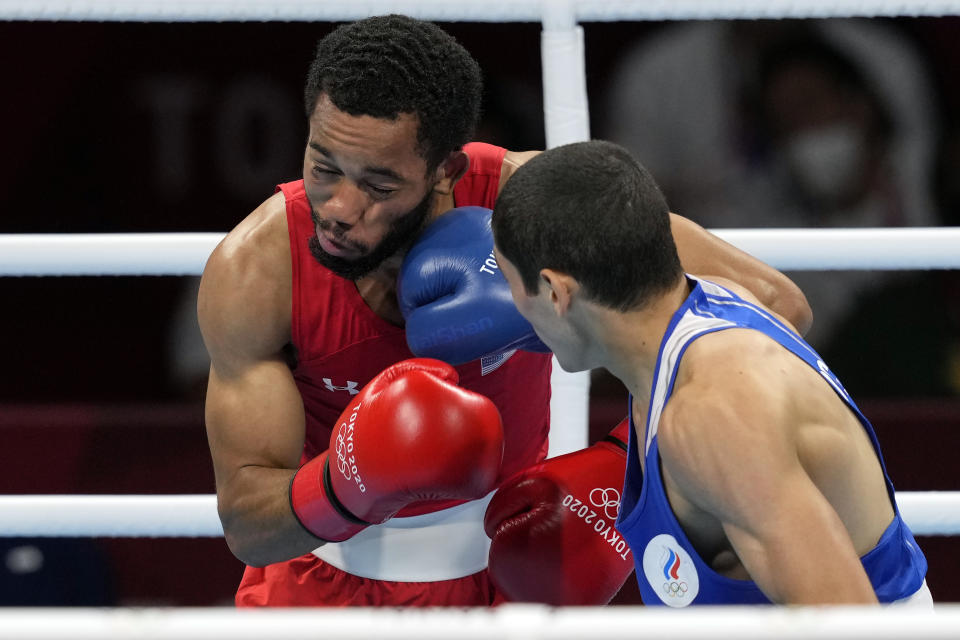 Albert Batyrgaziev, of the Russian Olympic Committee, right, connects with a punch to Duke Ragan, of the United States, during their final round feather weight 52-57kg final boxing match at the 2020 Summer Olympics, Thursday, Aug. 5, 2021, in Tokyo, Japan. (AP Photo/Themba Hadebe)