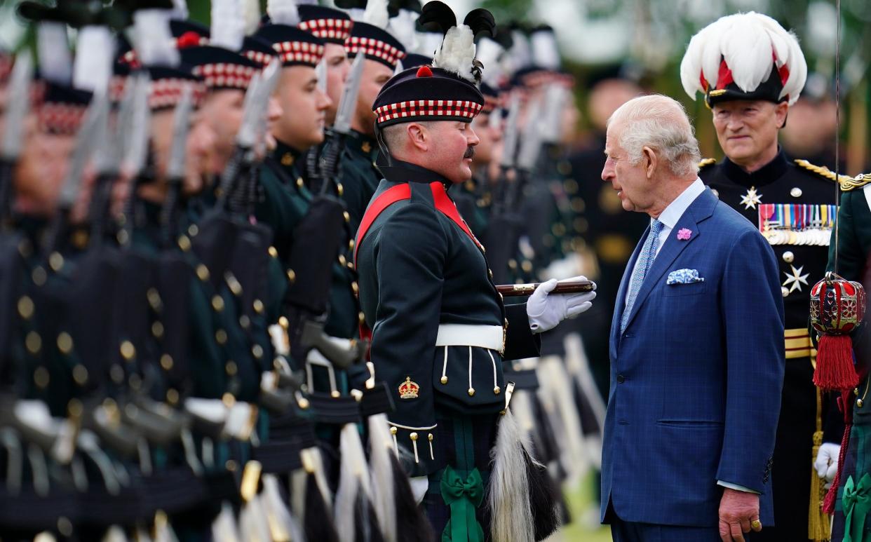 The King wore a blue suit rather than the kilt he donned for last year's ceremony