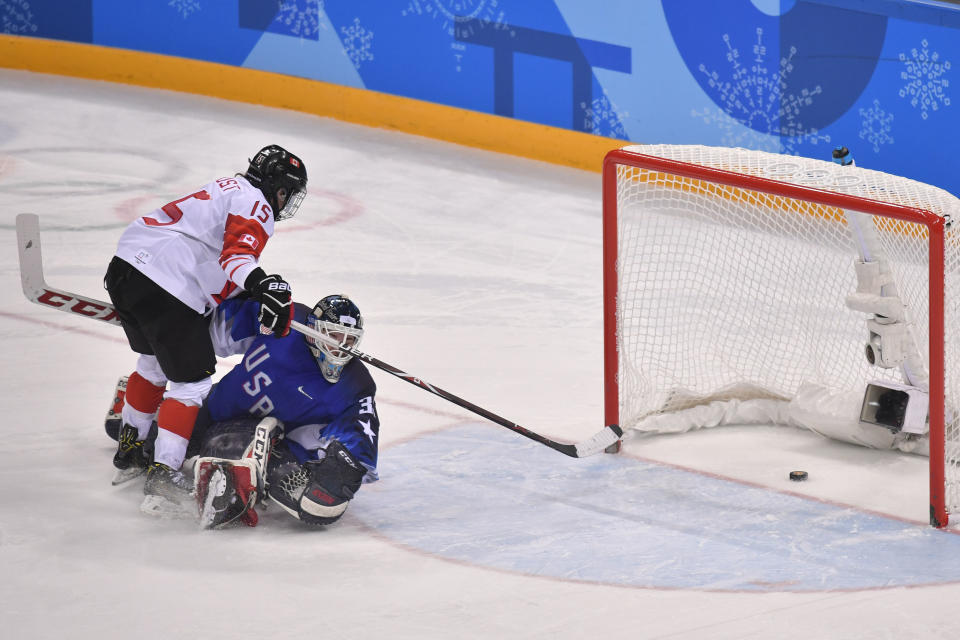 <p>Canada’s Melodie Daoust (L) scores a goal in the penalty shoot out in the women’s gold medal ice hockey match between Canada and the US during the Pyeongchang 2018 Winter Olympic Games at the Gangneung Hockey Centre in Gangneung on February 22, 2018. / AFP PHOTO / Ed Jones </p>
