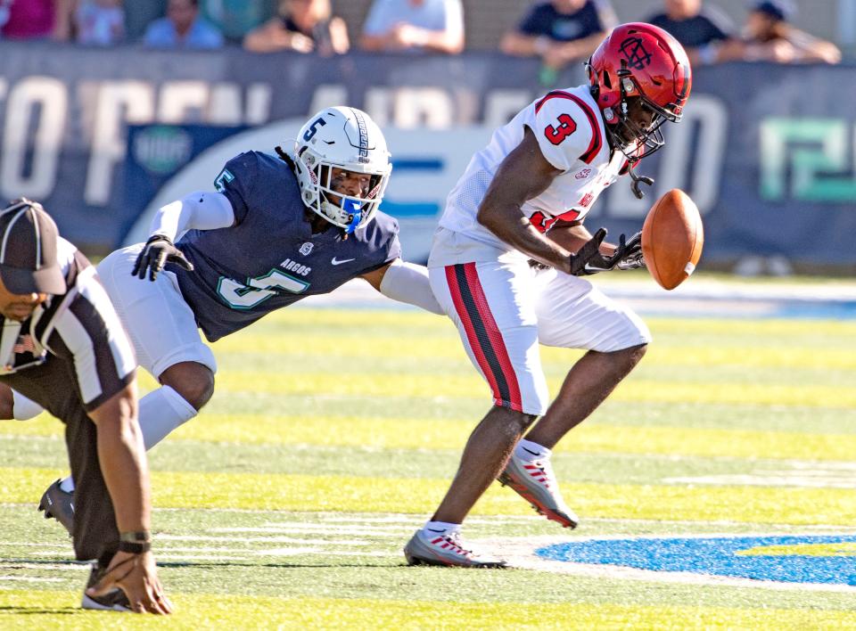 West Florida's Anthony Johnson Jr. goes after North Greenville's Doug Washington as they take on North Greenville at Pen Air Field at the University of West Florida Saturday,, October 1, 2022.