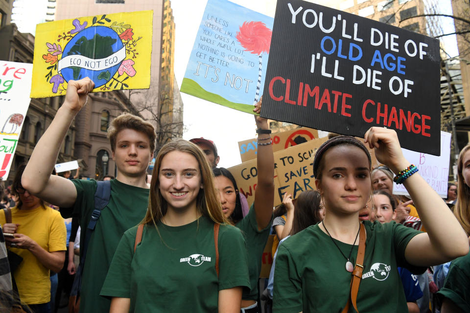 Large crowds march during the The Global Strike 4 Climate rally Melbourne, Friday, September 20, 2019. The Global Strike 4 Climate will take place in 110 towns and cities across Australia, with organisers demanding government and business commit to a target of net zero carbon emissions by 2030. (AAP Image/James Ross) NO ARCHIVING