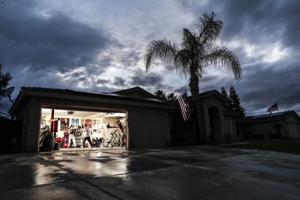 Gonzalo Montellano is shown giving a boxing lesson in his garage.