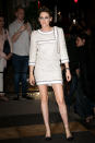 <p>Arriving at the Chanel and <em>Vanity Fair France</em> party, Kristen Stewart took her hemline shorter by wearing a mini dress by Chanel paired with the brand’s iconic plastic boots. (Photo: Getty) </p>