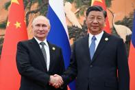 Chinese President Xi Jinping, right, and Russian President Vladimir Putin pose for a photo prior to their talks on the sidelines of the Belt and Road Forum in Beijing, China, on Wednesday, Oct. 18, 2023. (Sergei Guneyev, Sputnik, Kremlin Pool Photo via AP)