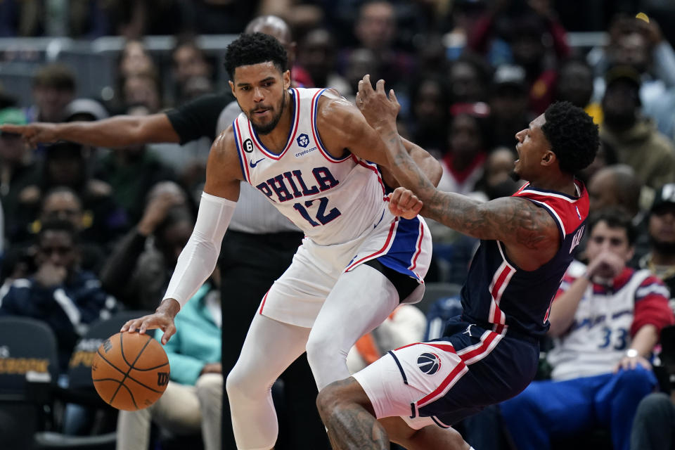 Philadelphia 76ers forward Tobias Harris (12) drives against Washington Wizards guard Bradley Beal in the first half of an NBA basketball game, Monday, Oct. 31, 2022, in Washington. (AP Photo/Patrick Semansky)