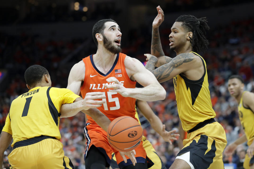 Illinois' Giorgi Bezhanishvili (15) has the ball knocked away by Missouri's Xavier Pinson (1) as Missouri's Mitchell Smith defends during the first half of an NCAA college basketball game Saturday, Dec. 21, 2019, in St. Louis. (AP Photo/Jeff Roberson)