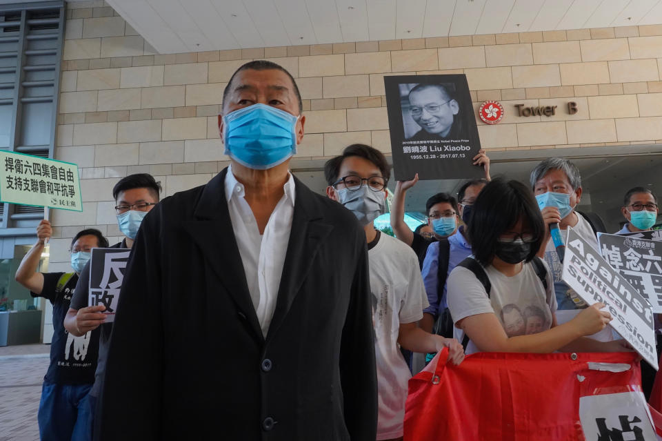 Hong Kong media tycoon Jimmy Lai, founder of the local newspaper Apple Daily, arrives outside a district court in Hong Kong, Monday, July 13, 2020. Activists including Lai who organized the June 4th Tiananmen massacre memorial this year, which was banned by police because of anti-virus social distancing reasons, had to make an appearance in court for charges for organizing and participating in the memorial. (AP Photo/Vincent Yu)