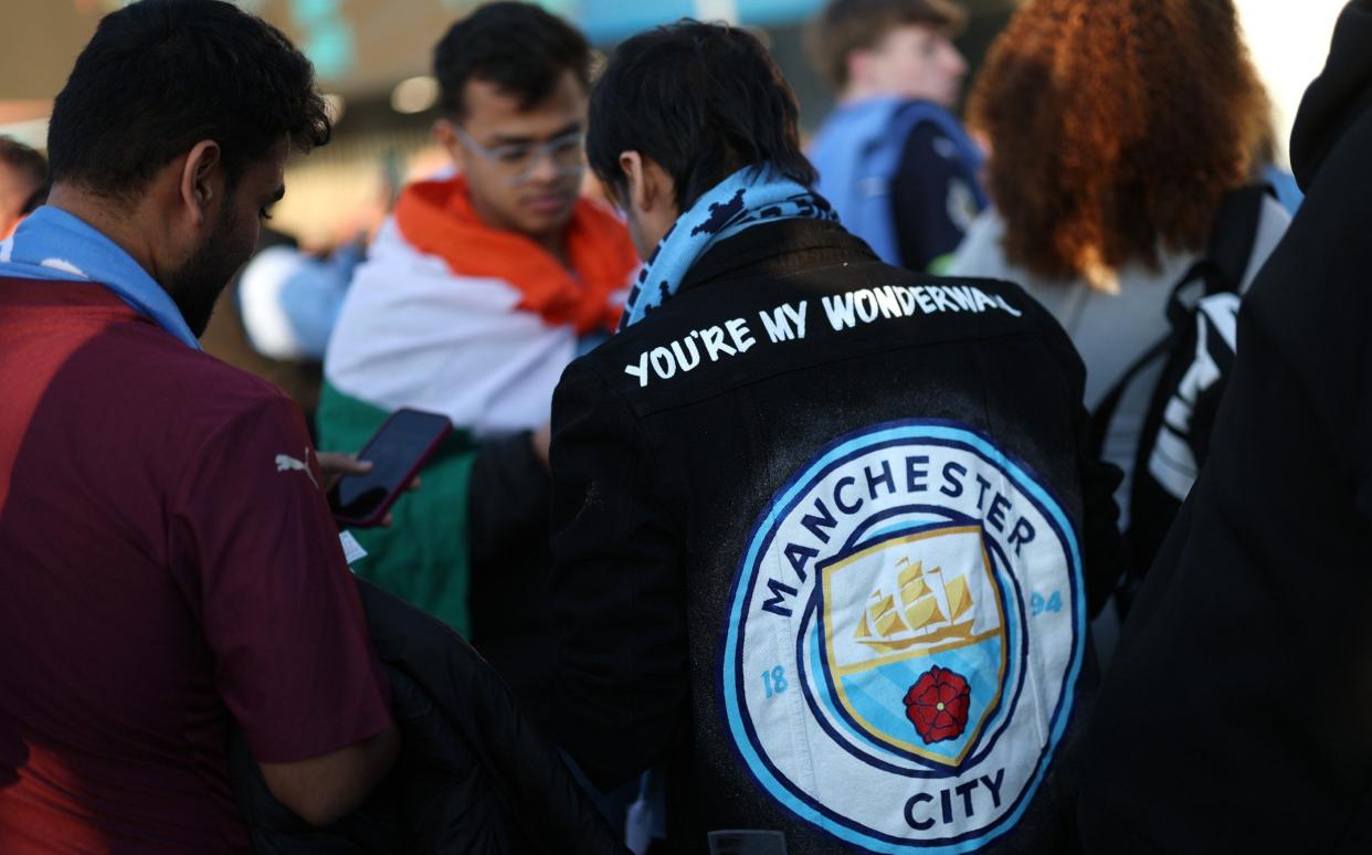 A Man City fan before the game against Inter