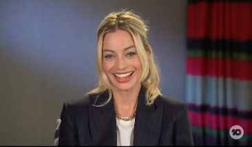 Margot Robbie laughing during an interview on The Project 