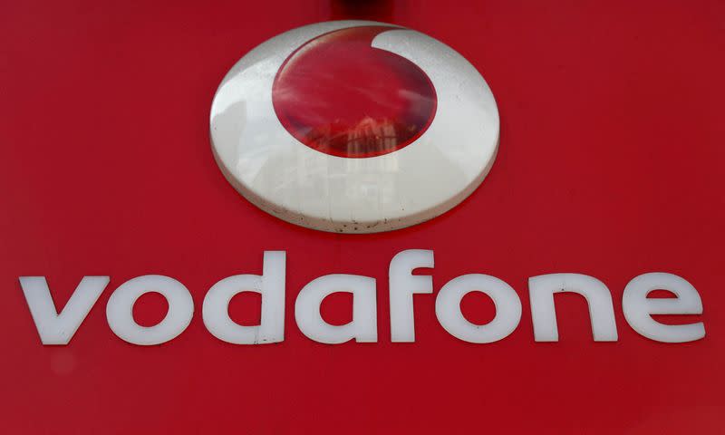 FILE PHOTO: A branded sign is displayed on a Vodafone store in London