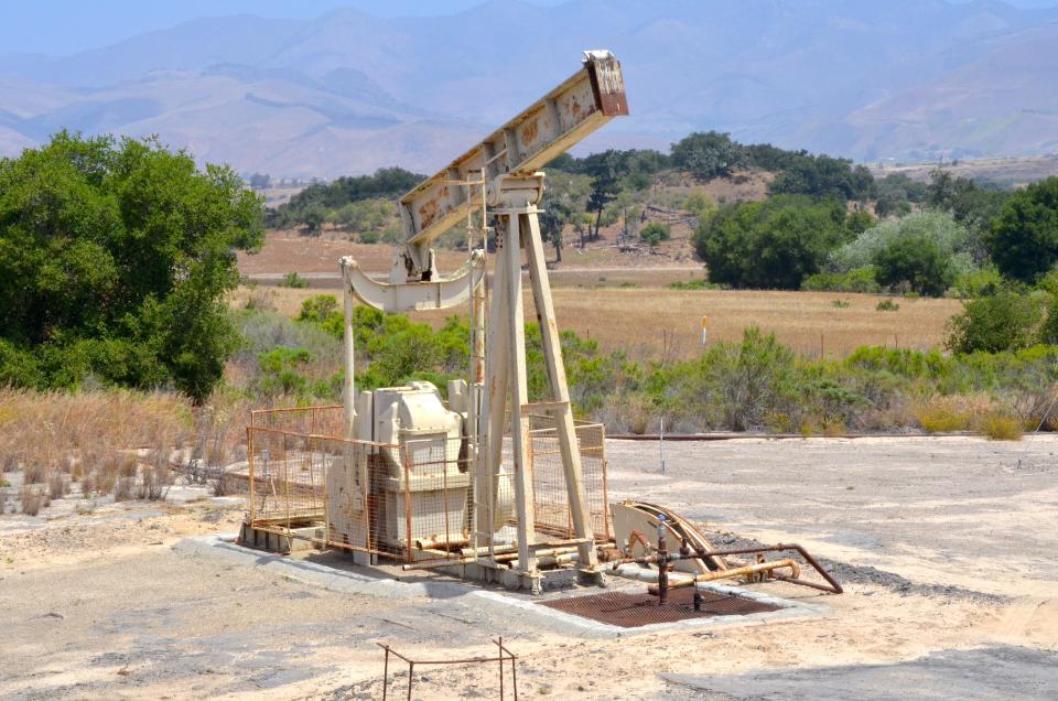 A pump jack sits idle and rusting in the Cat Canyon oil field, where Randeep Grewal's former company, HVI Cat Canyon, entered bankruptcy and left hundreds of oil wells idle.