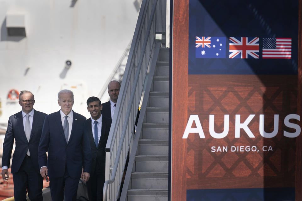 FILE - Britain's Prime Minister Rishi Sunak, second right, walks during a meeting with U.S. President Joe Biden, second left, and Australian Prime Minister Anthony Albanese, left, at Point Loma naval base in San Diego, Calif., on March 13, 2023, as part of AUKUS, a trilateral security pact between Australia, the UK, and the U.S. As the United States and China vie to establish new partnerships and expand influence with Asia-Pacific nations, the top defense officials from both nations are preparing to try to win support this weekend from their regional counterparts, diplomats and leaders at a security forum in Singapore. (Stefan Rousseau/Pool Photo via AP, File)