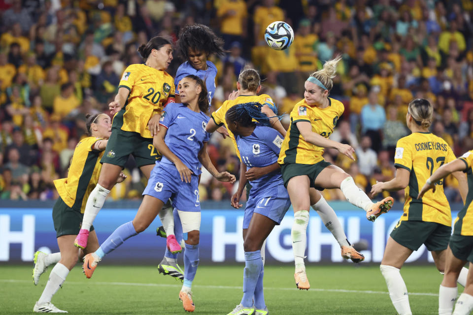 France's Wendie Renard heads the ball during the Women's World Cup quarterfinal soccer match between Australia and France in Brisbane, Australia, Saturday, Aug. 12, 2023. (AP Photo/Tertius Pickard)
