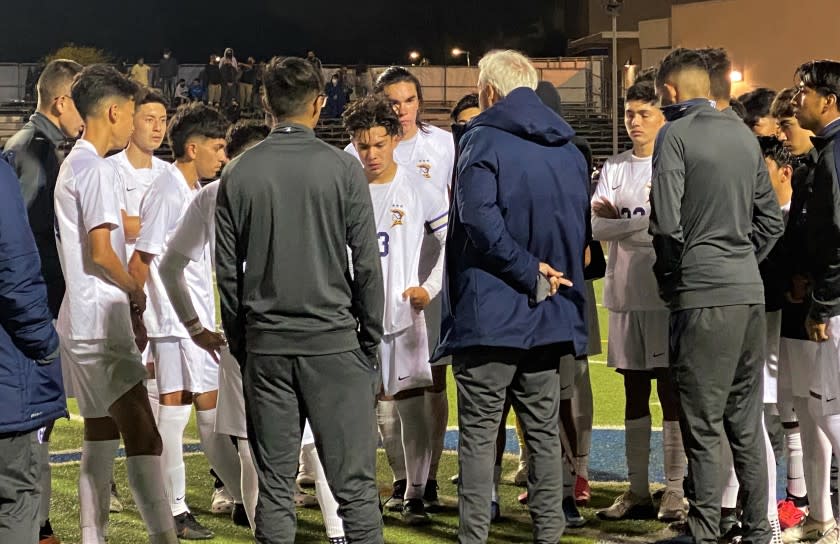 Birmingham coach EB Madha talks to his players.