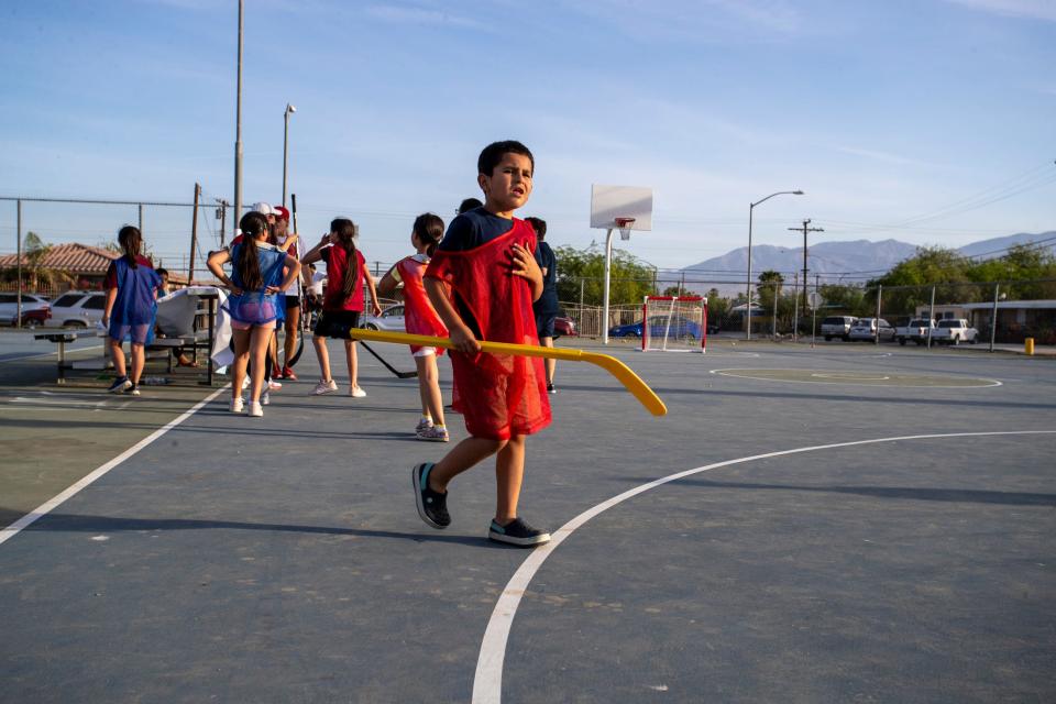 Youth participate in the Coachella Valley Firebirds and Acrisure Arena street hockey clinic at Mecca Community Park in Mecca, Calif., on Monday, May 23, 2022. 