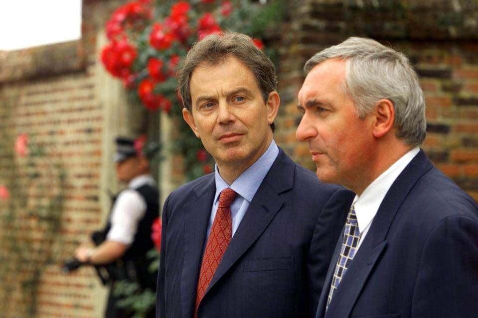 British prime minister Tony Blair, centre, and his Irish counterpart Bertie Ahern talk to the media at Chequers, near Aylesbury (PA Archive) (PA Archive)
